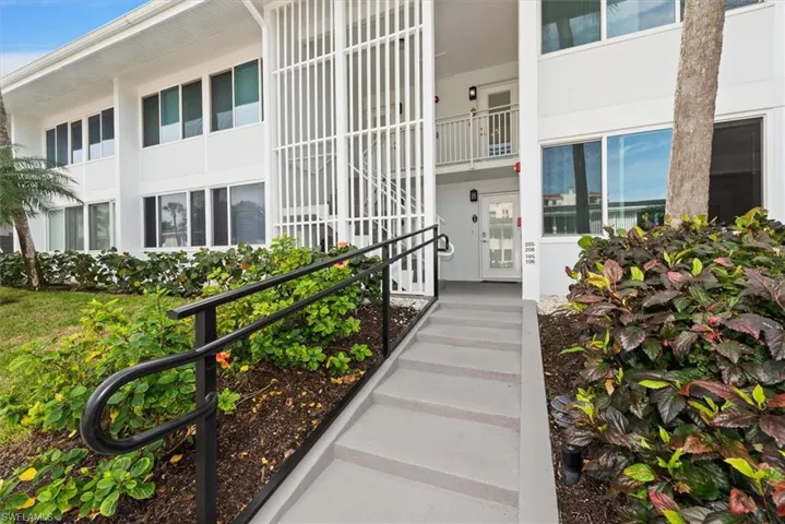 Entrance to property featuring stucco siding