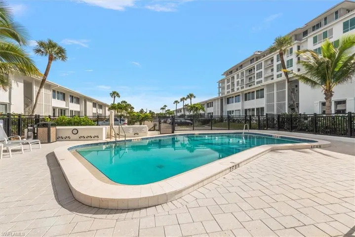 Community pool featuring a patio area