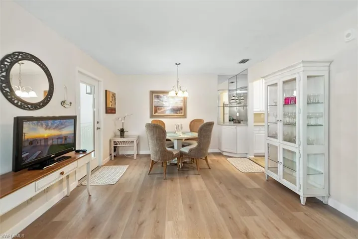 Dining space with a chandelier and light wood finished floors