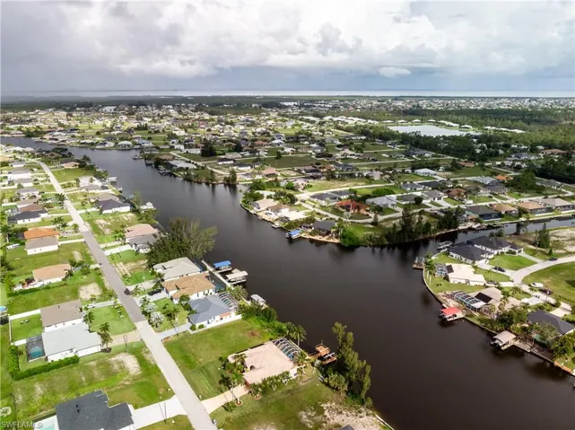 Aerial view of property and surrounding area featuring gulf access