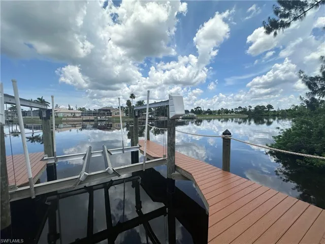 Dock featuring a water view and boat lift