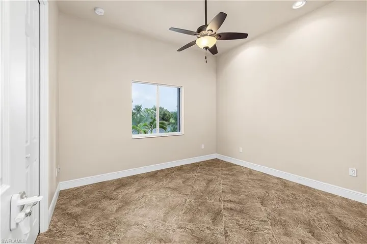 Bedroom featuring a smoke detector, ceiling fan, and recessed lighting