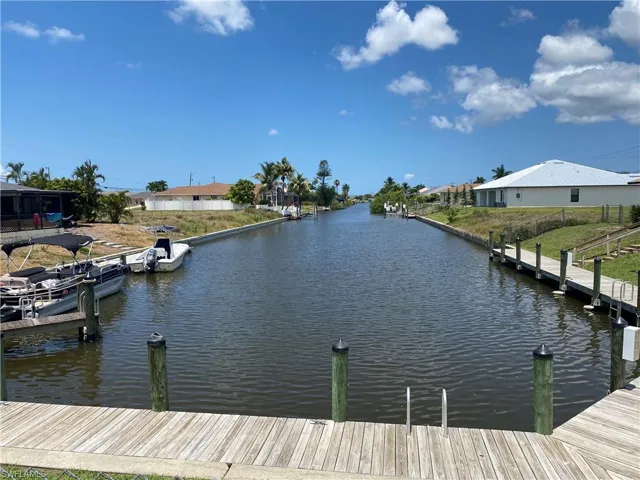 Dock area featuring a water view