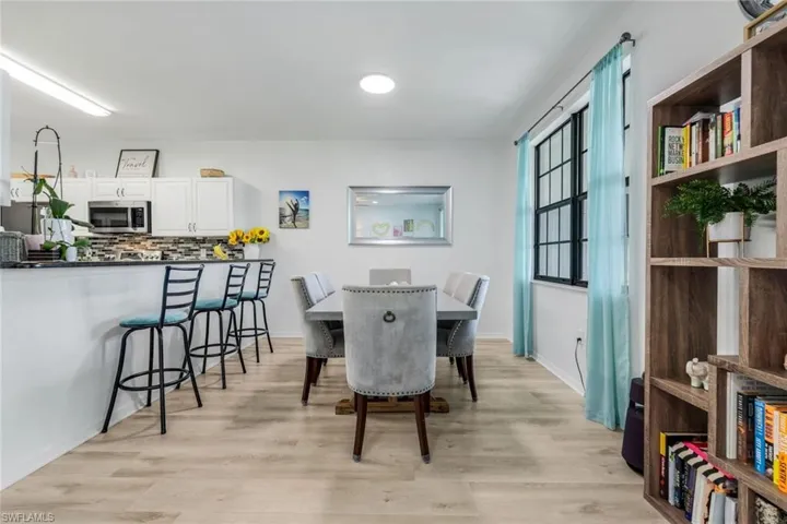 Dining room featuring light wood-style floors and recessed lighting
