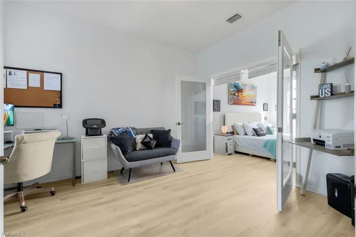 Home office featuring light wood-style flooring and french doors