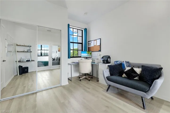 Home office with light wood finished floors