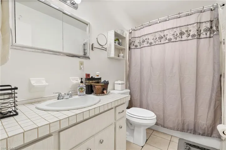 Bathroom featuring vanity and light tile patterned floors