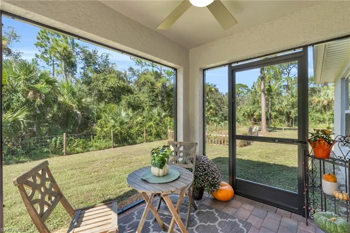 Sunroom featuring ceiling fan