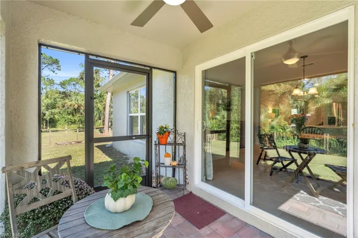Sunroom featuring ceiling fan