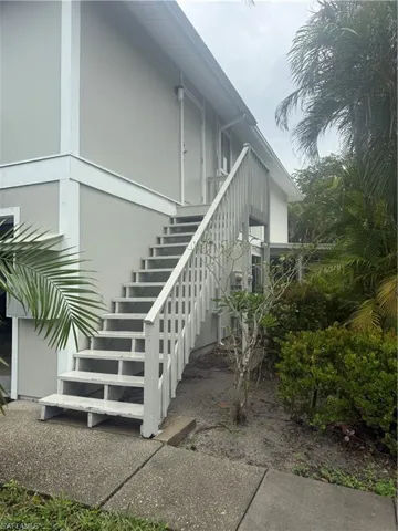View of property exterior featuring stairs