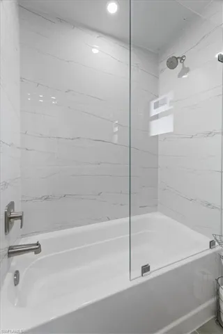 Full bathroom with tub / shower combination