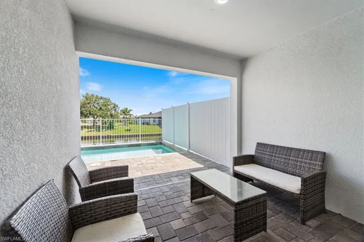 Fenced backyard featuring a patio and outdoor seating