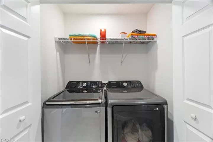 Laundry area featuring separate washer and dryer