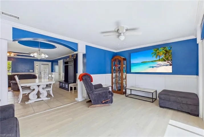 A spacious den offers flexibility as a home office, media room, or additional guest space.