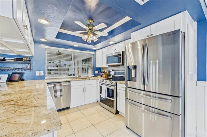 Perfectly positioned for entertaining, the kitchen offers easy access to both indoor and outdoor living areas.