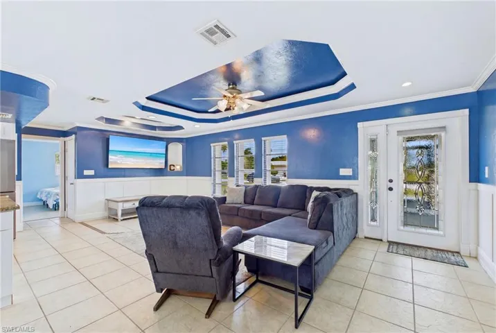 Designed with both comfort and entertaining in mind, this inviting living area serves as the heart of the home.