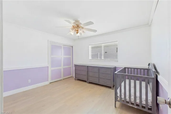 Natural light fills this welcoming guest bedroom, creating a warm and airy atmosphere.