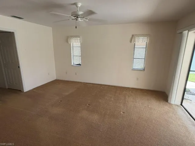 Large Primary Bedroom with slider access out to outdoor living spaces/ pool.