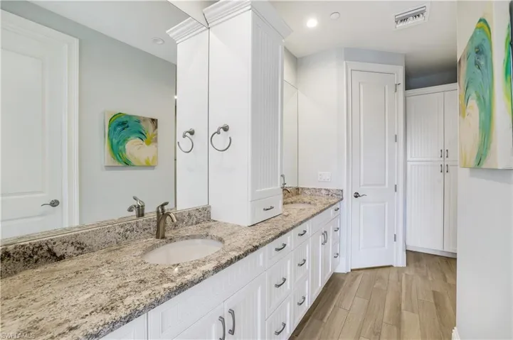 Bathroom with vanity and hardwood / wood-style floors