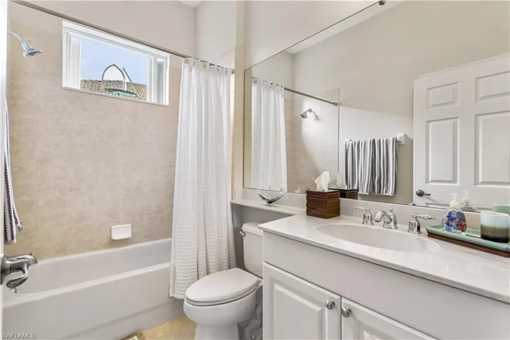 Full guest bathroom with linen closet