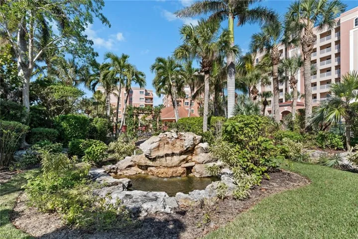 View of property's community with a garden pond