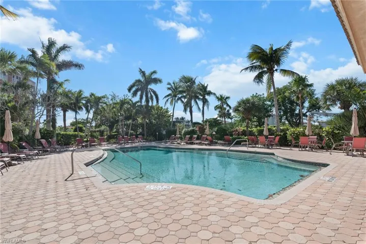 Community pool featuring a patio