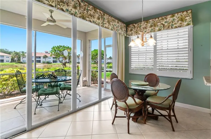 screened porch/lanai with tile floor and southerly lake view