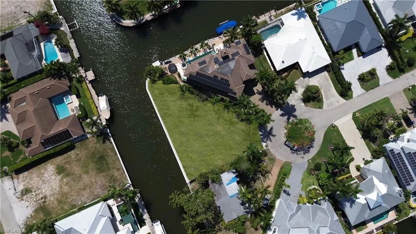 Aerial view of residential area with a large body of water