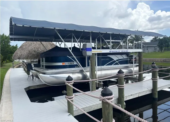 Dock area featuring boat lift