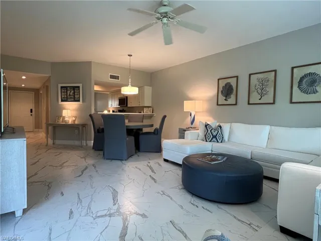 Tiled living room with ceiling fan