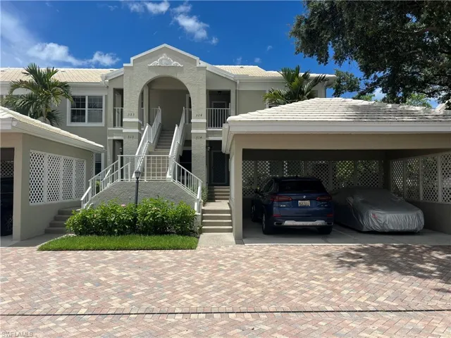View of front of house featuring a carport