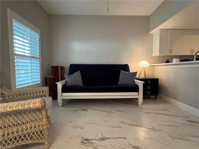 Sitting room with light tile patterned floors