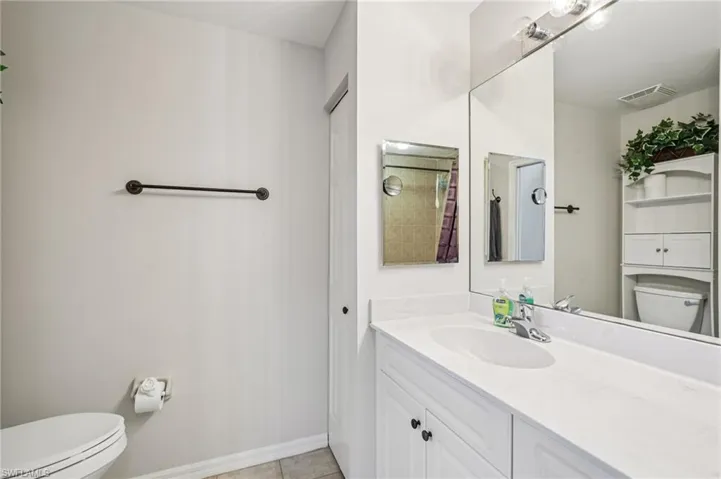 Bathroom with vanity and light tile patterned floors