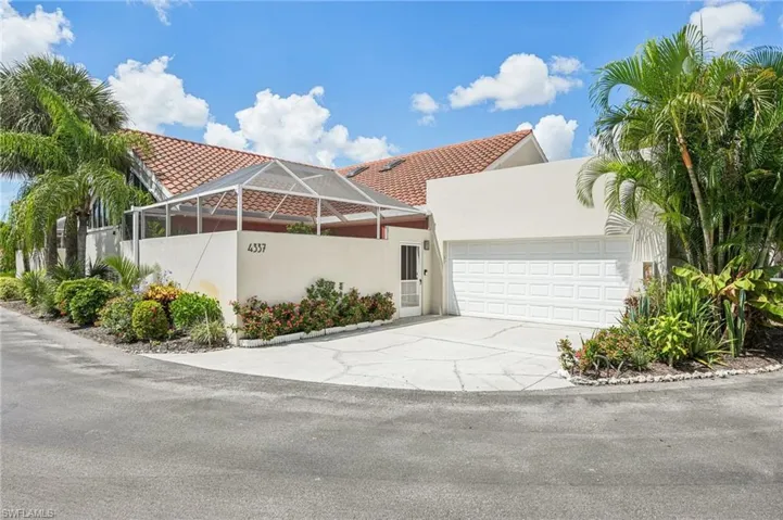 Mediterranean / spanish-style house featuring stucco siding, concrete driveway, an attached garage, and a tiled roof
