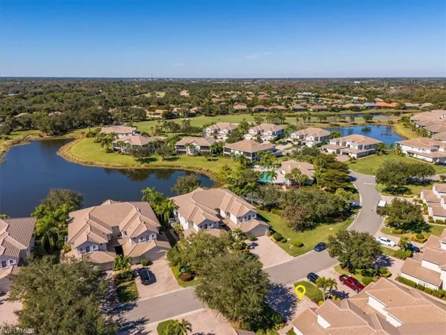 View of property location with a nearby body of water and nearby suburban area