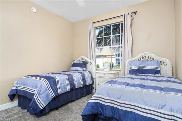Bedroom featuring carpet flooring and a ceiling fan