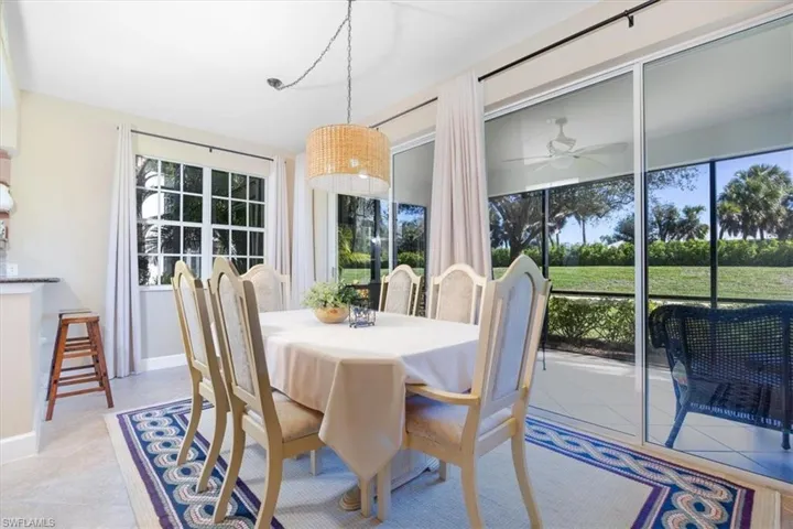 Dining room with ceiling fan and baseboards