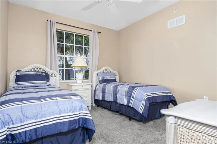 Bedroom with carpet floors and a ceiling fan