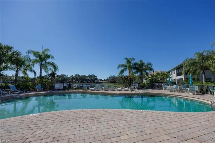 Community pool with a patio