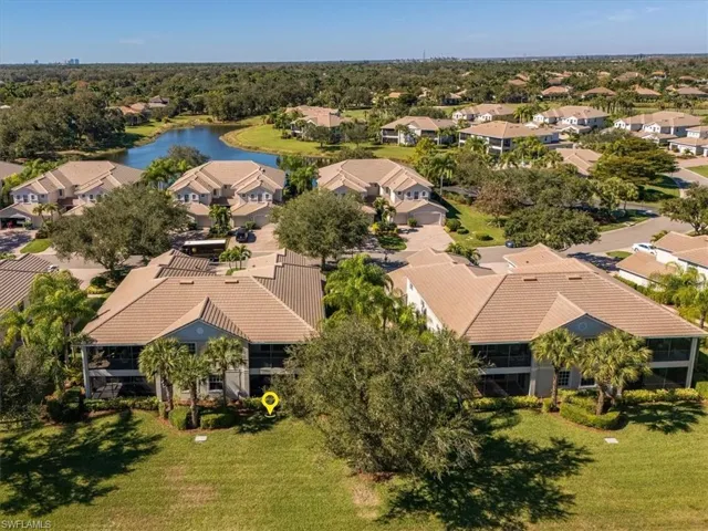 Aerial perspective of suburban area with a large body of water