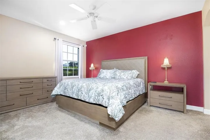 Bedroom featuring carpet and ceiling fan