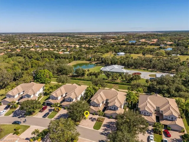 Aerial overview of property's location featuring a large body of water and nearby suburban area
