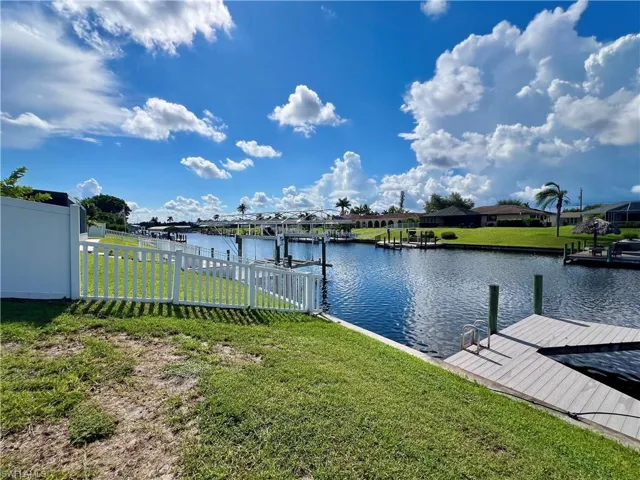 Dock featuring a water view and a residential view