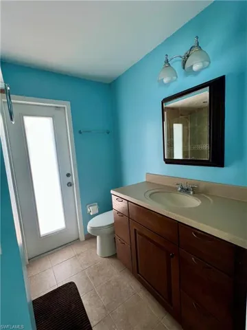 Bathroom featuring vanity and light tile patterned floors