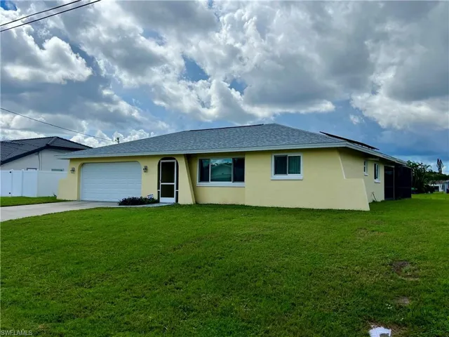 Single story home featuring stucco siding, a shingled roof, driveway, and an attached garage
