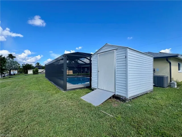 View of shed with an outdoor pool