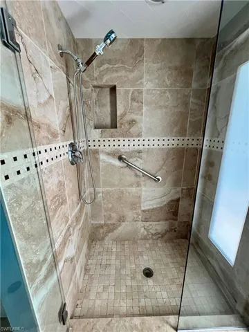 Full bath with a shower stall