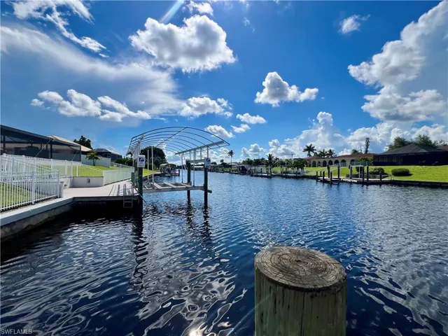 Dock area featuring a water view