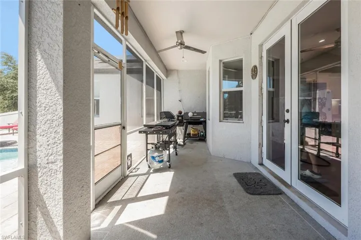 Patio / solarium featuring plenty of natural light and ceiling fan