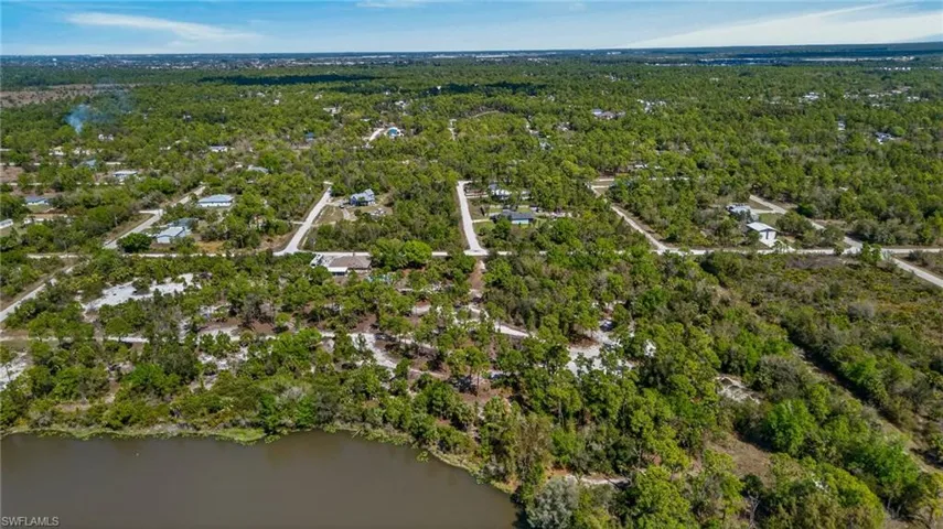 View of property location featuring a heavily wooded area